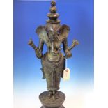 TWO SRI LANKHAN BRONZE FIGURES OF GANESH STANDING HOLDING ATTRIBUTES IN HIS TWO LEFT HANDS AND