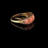AN ANTIQUE 18ct GOLD UNHALLMARKED CORAL AND DIAMOND GRADUATED CARVED HALF HOOP RING. FINGER SIZE L