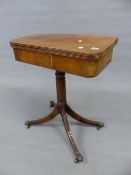 A REGENCY MAHOGANY SMALL FOLD OVER TEA TABLE ON SPIRAL TURNED COLUMN AND QUADRUPED SABRE LEGS. 61