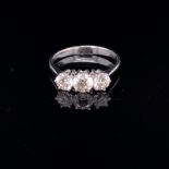 AN 18ct WHITE GOLD THREE STONE DIAMOND TRILOGY RING. FINGER SIZE N. WEIGHT 2.2grms.