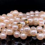 A OPERA LENGTH CULTURED PEARL NECKLACE COMPLETE WITH AN INTEGRAL 18ct GOLD CLASP, AND A SMALL