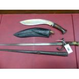 A 19TH CENTURY BAYONET IN STEEL SCABBARD TOGETHER WITH A KUKRI IN LEATHER SCABBARD (2)