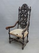 A 17th C. FRENCH STYLE OAK ELBOW CHAIR, THE TALL BACK PIERCED AND CARVED WITH FOLIAGE SPLAT