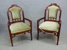 A PAIR OF ART NOUVEAU MAHOGANY CHAIRS, THE FOLIATE INCISED CRESTING TO OLIVE VELVET UPHOLSTERED