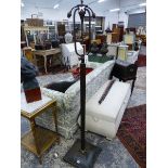 A STYLISH BRONZE ART DECO FLOOR LAMP WITH UNUSUAL ADJUSTABLE PIVOT MECHANISM. H. 168cms.