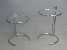 A PAIR OF GLASS TOPPED TUBULAR CHROME TABLES WITH CIRCULAR TOPS, THE PAIRED COLUMNS TO ONE SIDE ON