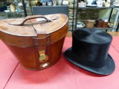 A RED SILK LINED LEATHER CASED HENRY HEATH TOP HAT WITH BLACK SILK PILE, THE INSIDE OF THE HAT. 8