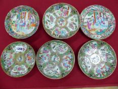 FIVE CANTON SAUCERS AND A SIDE PLATE, THE LATTER MATCHING A SAUCER WITH CENTRAL FIGURES, THE