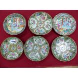 FIVE CANTON SAUCERS AND A SIDE PLATE, THE LATTER MATCHING A SAUCER WITH CENTRAL FIGURES, THE