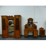 A VICTORIAN WALNUT BEDROOM SUITE, THE DOORS CARVED WITH FRUIT AND SCROLLING FOLIAGE, COMPRISING: A