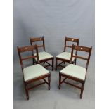 A SET OF FOUR GEORGE IV MAHOGANY DINING CHAIRS WITH REEDED BACK UPRIGHTS AND RAILS, DROP IN SEATS ON