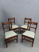 A SET OF FOUR GEORGE IV MAHOGANY DINING CHAIRS WITH REEDED BACK UPRIGHTS AND RAILS, DROP IN SEATS ON