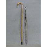 A HORN WALKING STICK OF AMBER HUE TOGETHER WITH A WALKING CANE FORMED OF HORN IN BANDS OF COLOURS