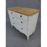 A PARTIALLY PAINTED PINE CHEST OF TWO SHORT AND TWO LONG DRAWERS ABOVE A WAVY APRON AND BETWEEN