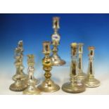 A COLLECTION OF FOUR PAIRS AND ANOTHER VARNISH GLASS CANDLESTICKS, THE TALLEST OF THE INTERNALLY