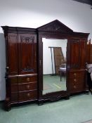 A GOOD 19TH.C. MAHOGANY COMPACTUM IN THE ARCHITECTURAL NEO-CLASSICAL TASTE. CARVED ARCH PEDIMENT