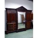 A GOOD 19TH.C. MAHOGANY COMPACTUM IN THE ARCHITECTURAL NEO-CLASSICAL TASTE. CARVED ARCH PEDIMENT