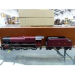 AN UNKNOWN 'O' GAUGE LOCOMOTIVE AND TENDER LMS 4-6-0 "NOVELTY" NO. 5733 IN WOODEN TRANSIT BOX.
