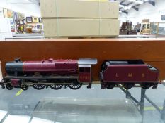 AN UNKNOWN 'O' GAUGE LOCOMOTIVE AND TENDER LMS 4-6-0 "NOVELTY" NO. 5733 IN WOODEN TRANSIT BOX.