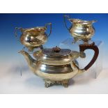 A HALLMARKED SILVER THREE PIECE TEA SET COMPRISING OF A TEAPOT, SUGAR AND CREAMER. DATED 1970