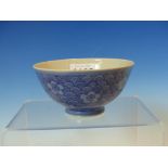 A CHINESE BOWL, THE LIGHT BLUE GROUND OF THE EXTERIOR PAINTED IN DARKER BLUE WITH CHERRY BLOSSOMS ON