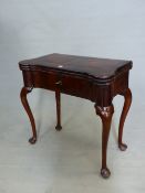 AN ANTIQUE HARDWOOD TRIPLE TOP GAMES TABLE THE RECTANGULAR ROSEWOOD TOP ROUNDED OVER INTERIOR CANDLE