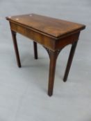 AN 18th.C. MAHOGANY FOLD OVER GAMES TABLE WITH PIERCED BRACKETS TO THE SQUARE CHAMFERED