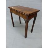 AN 18th.C. MAHOGANY FOLD OVER GAMES TABLE WITH PIERCED BRACKETS TO THE SQUARE CHAMFERED