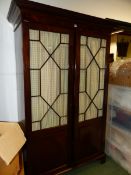 AN ANTIQUE MAHOGANY GLAZED DOOR HANGING CUPBOARD IN THE GEORGIAN TASTE, BASE DRAWER TO INTERIOR, H.