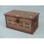 AN ISLAMIC HARDWOOD BOX, THE RECTANGULAR HINGED LID INLAID WITH A CHEQUERBOARD OF MOTHER OF PEARL. W