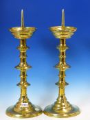A PAIR OF BRASS PRICKET CANDLESTICKS, THE CIRCULAR FEET INSCRIBED ST JAMES THE LESS, EAST HANNEY,