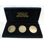A CASED SET OF THREE RUSSIAN COMMEMORATIVE COINS TOGETHER WITH A SMALL COLLECTION OF WORLD COINS