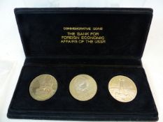 A CASED SET OF THREE RUSSIAN COMMEMORATIVE COINS TOGETHER WITH A SMALL COLLECTION OF WORLD COINS