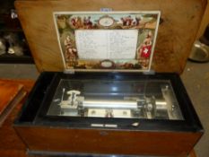 A VINTAGE SWISS WALNUT CASED MUSIC BOX PLAYING SIX AIRS ON A CHROME PLATED 17cms. CYLINDER, THE LABE