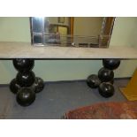 AN UNUSUAL MARBLE TOP CONSOLE TABLE ON STACKED BALL SUPPORTS. 207cm x 38cm x H 76cm.