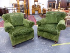 A PAIR OF VINTAGE GREEN VELVET UPHOLSTERED ARMCHAIRS ON LATER CASTOR FEET