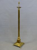 A BRASS CORINTHIAN COLUMN LAMP STANDARD SUPPORTED ON STEPPED SQUARE FOOT. H 138cms.