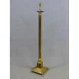 A BRASS CORINTHIAN COLUMN LAMP STANDARD SUPPORTED ON STEPPED SQUARE FOOT. H 138cms.