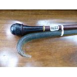 A WALKING CANE WITH SCREW TOPPED SNUFF BOX HANDLE TOGETHER WITH A GLASS WALKING STICK