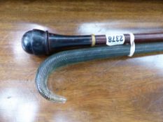 A WALKING CANE WITH SCREW TOPPED SNUFF BOX HANDLE TOGETHER WITH A GLASS WALKING STICK