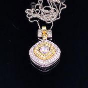 AN 18K STAMPED YELLOW AND WHITE GOLD MULTI DIAMOND MODERN PENDANT, SUSPENDED ON A PLATINUM