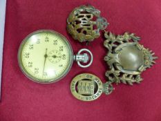 AN OPEN FACED WATCH FOR TIMING BOMBS FROM THE MOMENT OF RELEASE TO EXPLOSION, A BRASS RAF BADGE,