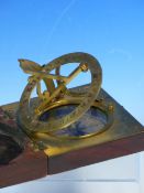 AN EARLY 19TH CENTURY BRASS AND MAHOGANY CASED COMPASS SUNDIAL BY THOS. RUBERGALL ( OPTICIAN TO