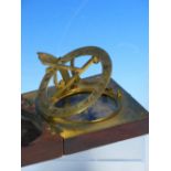 AN EARLY 19TH CENTURY BRASS AND MAHOGANY CASED COMPASS SUNDIAL BY THOS. RUBERGALL ( OPTICIAN TO