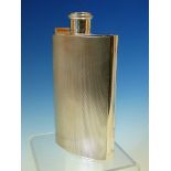 A SILVER HALLMARKED HIP FLASK WITH HINGED SCREW DOWN COVER. DATED 1940 LONDON FOR WILLIAM SUCKLING