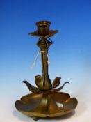 A BRONZE CANDLESTICK WITH FOUR TREFOILS FORMING THE DRIP PAN, THE COLUMN BASE AND FOOT OF SIX PETALS