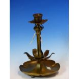 A BRONZE CANDLESTICK WITH FOUR TREFOILS FORMING THE DRIP PAN, THE COLUMN BASE AND FOOT OF SIX PETALS