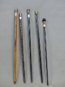 THREE WALKING CANES WITH HALLMARKED SILVER HANDLES, ANOTHER WITH PLATED HEAD AND THE LAST WITH A