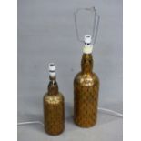 TWO BOTTLE TABLE LAMPS MOUNTED WITH OLD PENNIES, HALFPENNIES AND 3D BITS. H 48 AND 38cms.