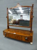 A GEORGE III MAHOGANY RECTANGULAR DRESSING TABLE MIRROR ON A BOW FRONT BOX WITH A CENTRAL DRAWER